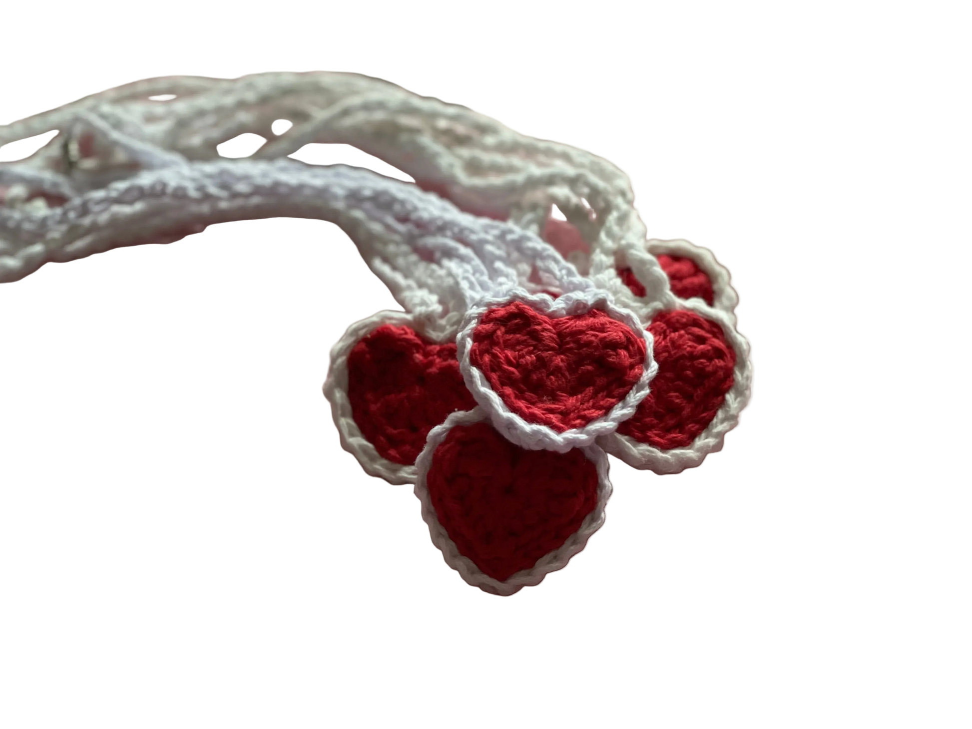 Crocheted red hearts with white lace on white crocheted pendants